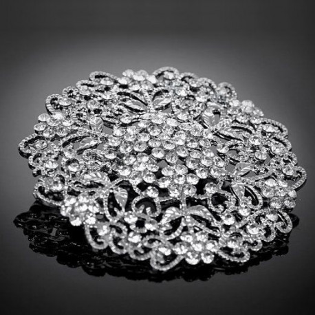 La broche en forme de rosette La broche en forme de rosette